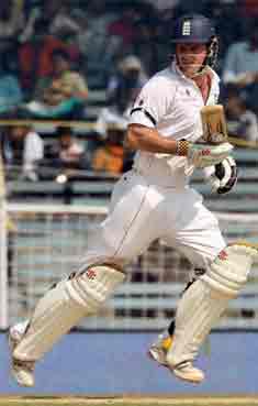 Andrew Strauss's 13th Test century held England together on the opening day of the series at Chennai.