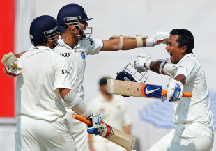 Laxman celebrates with Suresh Raina and Pragyan Ojha after sealing a thriller for India.