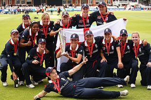 The England team poses with the ICC Women's World Twenty20 trophy after beating New Zealand by six wickets at Lord's