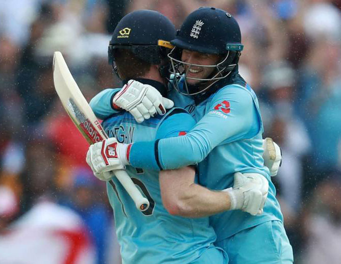 Root and Morgan celebrates England win.
